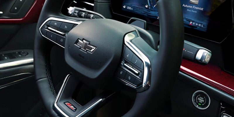 A close-up view of the steering wheel and controls inside the 2024 Chevrolet Traverse