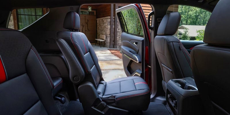 The second-row seats of the 2024 Chevrolet Traverse with a door open, showing legroom and access