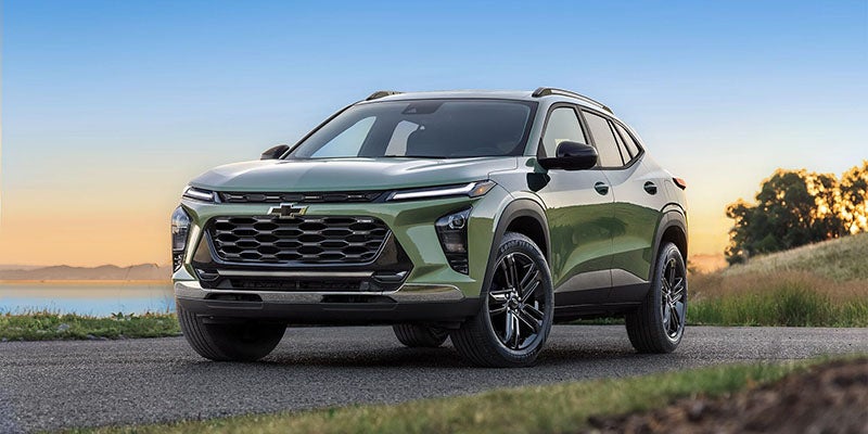 A green 2024 Chevrolet Trax parked road