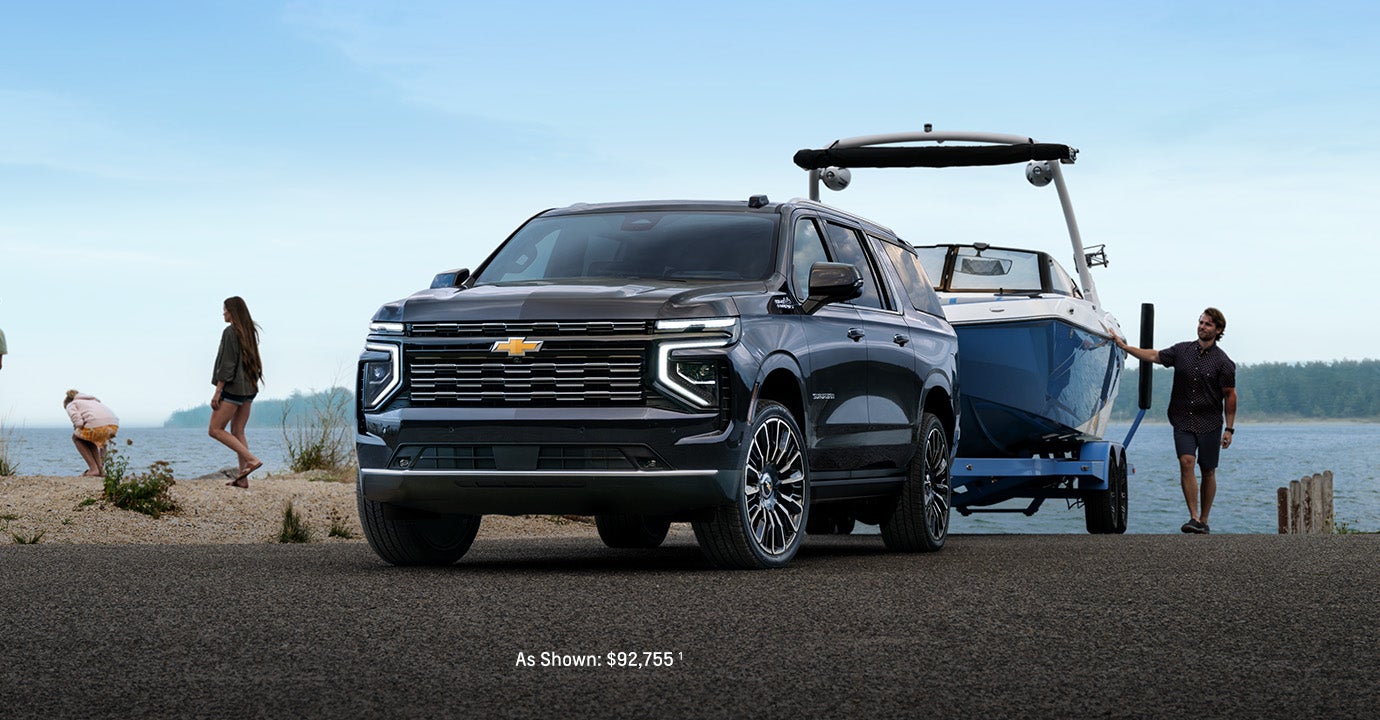 Black 2025 Chevrolet Suburban parked near a river