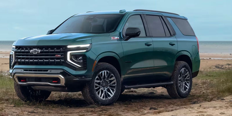 Green 2025 Chevrolet Suburban parked on the ground