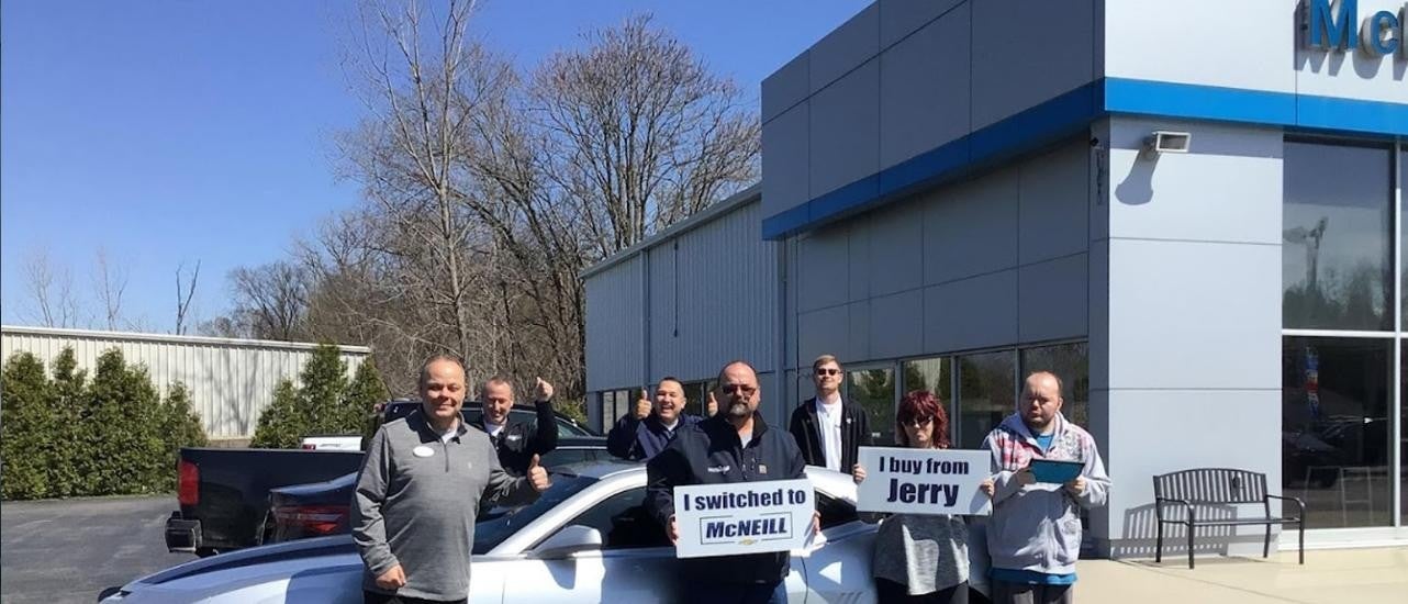 People Outside Chevrolet showroom