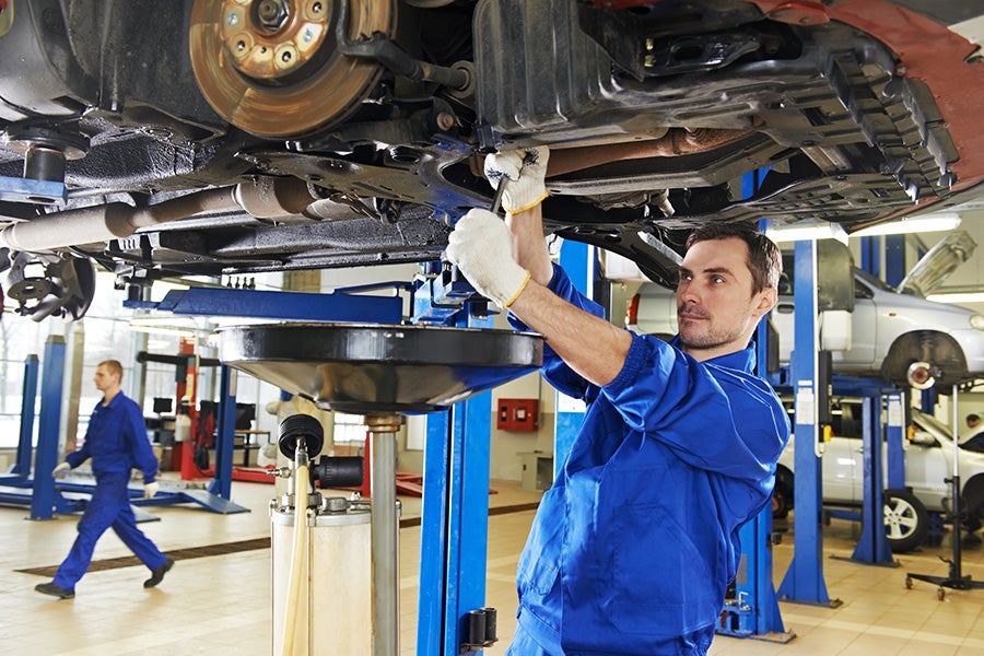 service expert servicing customer car
