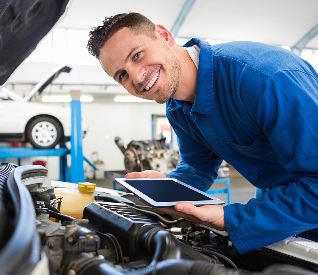 service expert servicing customer car